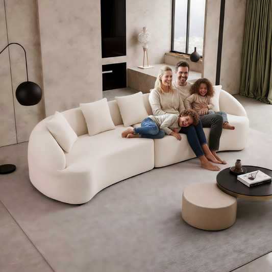 Family sitting on a modern white sofa in a stylish living room.